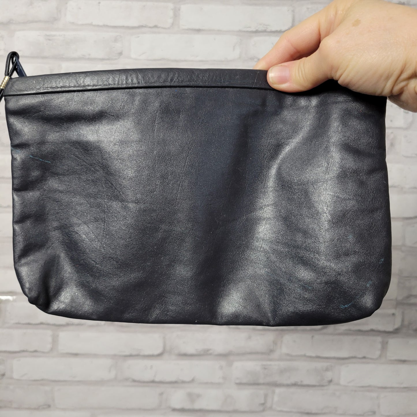 Pair of 1980s leather clutch bags -- navy blue and dove gray