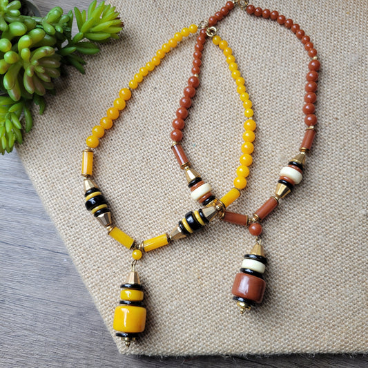 1960s lucite bead necklace 15-inches amber or cinnamon with black and gold-tone -- choice