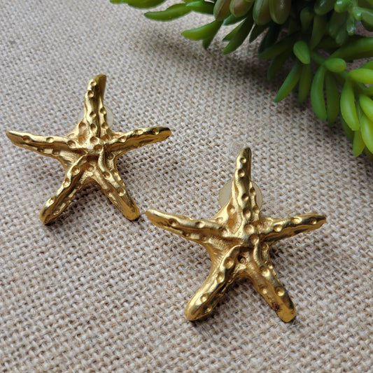1980s bold gold starfish pierced earrings cast metal, matte finish